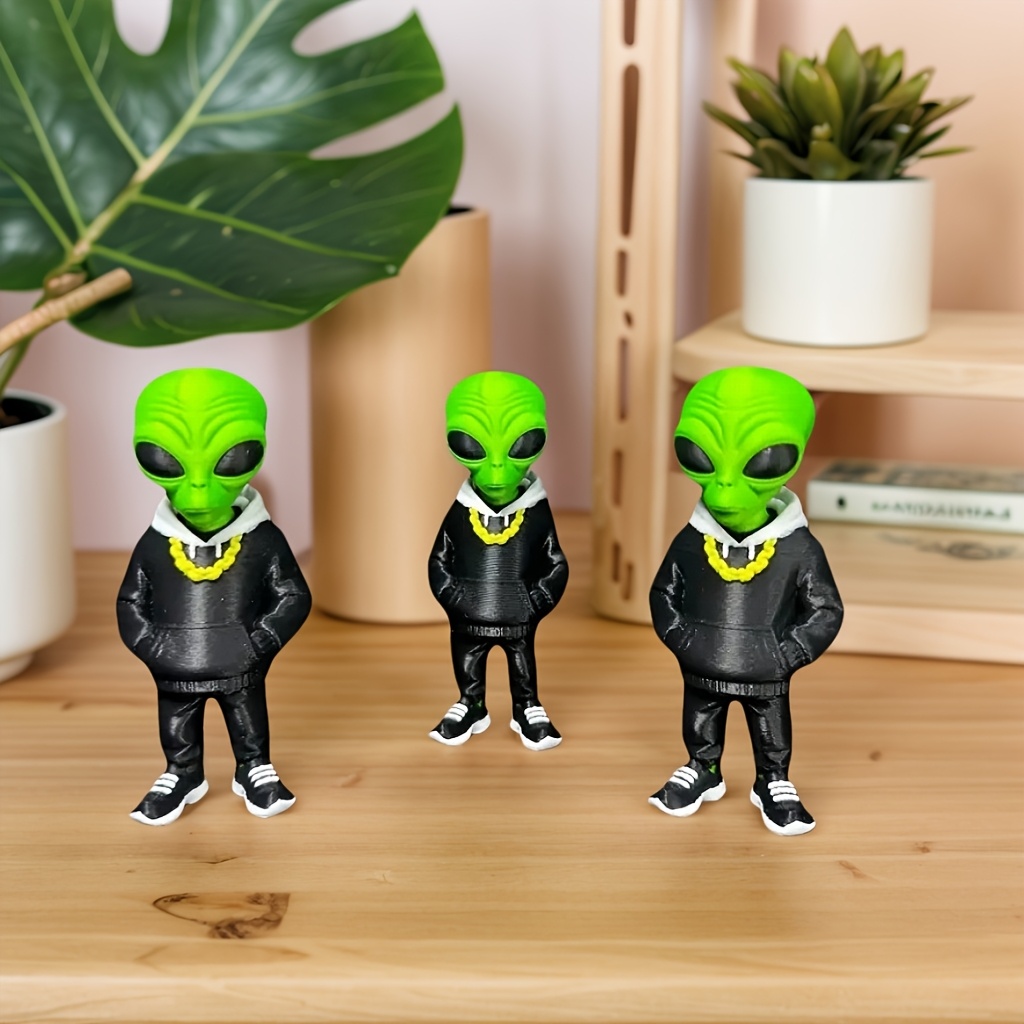 1 figurine d'alien verte avec  - Desk Setup Design avis et prix